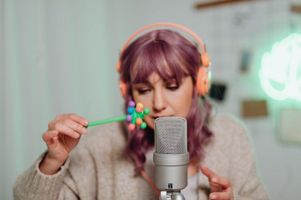 A woman doing ASMR into a microphone.