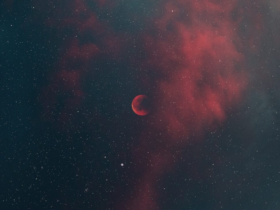 Full moon looking red in space. 