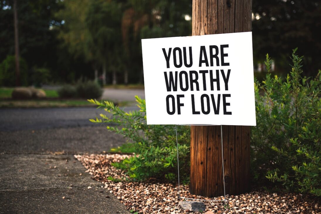 A sign that says "you are worthy of love" — which is an important lesson to learn when turning 50. 