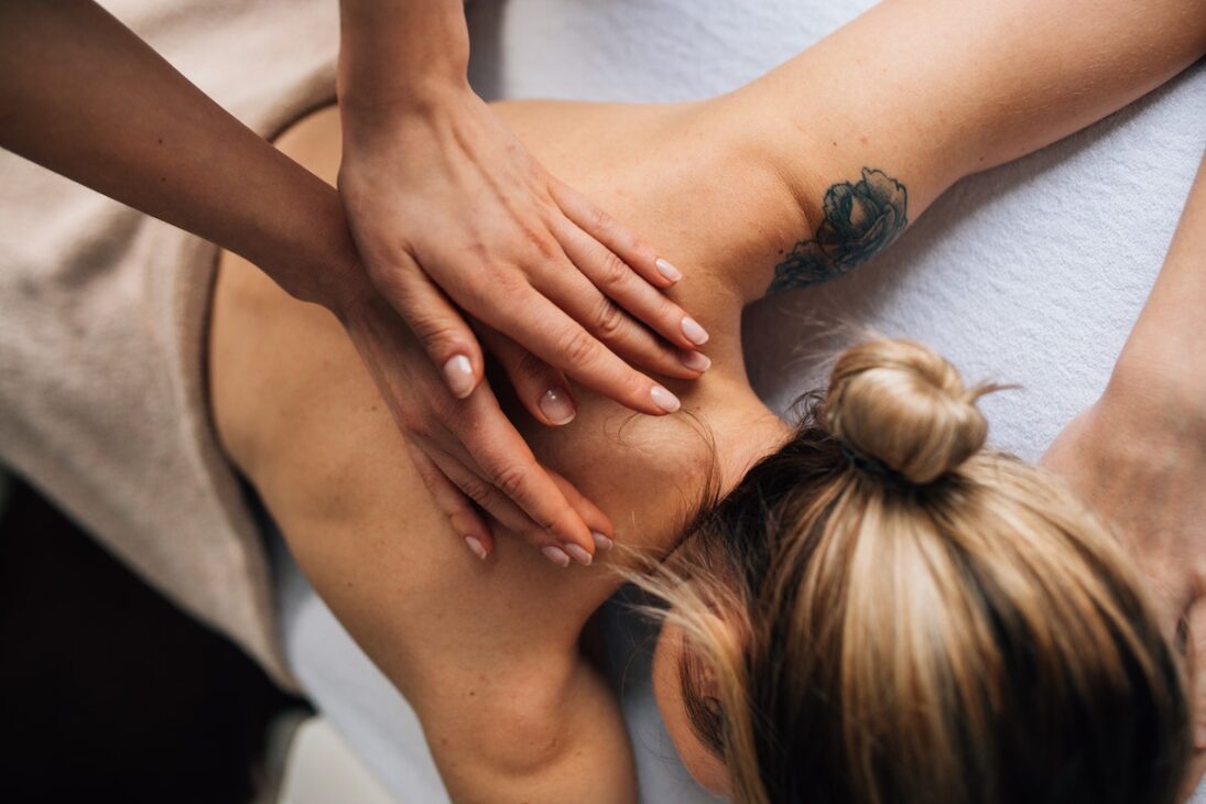 Woman getting a massage as self-care. 