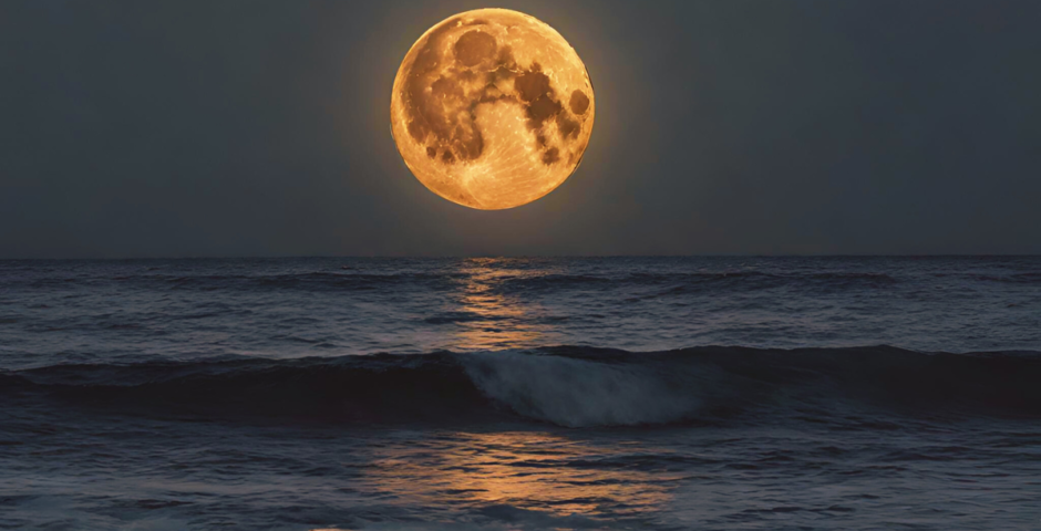 Full moon over the ocean.