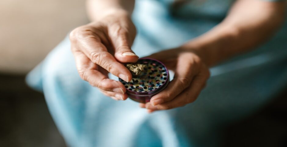 Woman holding cannabis.