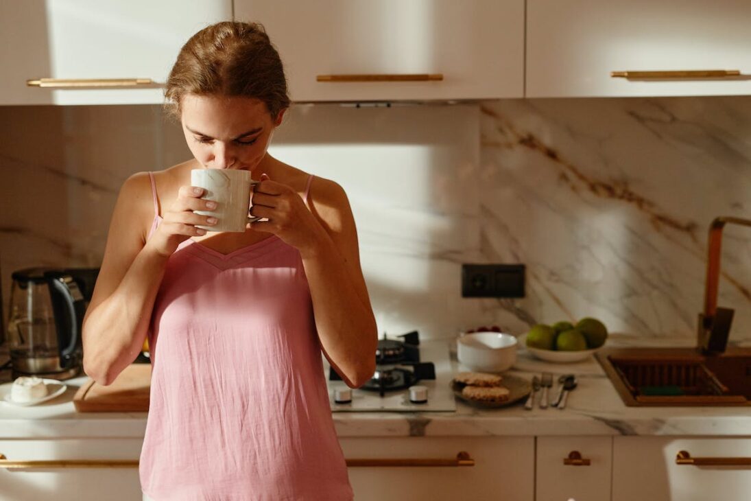 Woman sipping on tea in the morning 