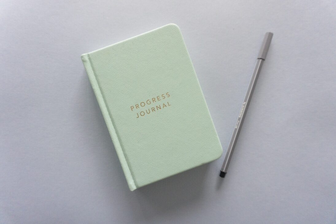 Writing in a progress journal can help track your Dry January journey.