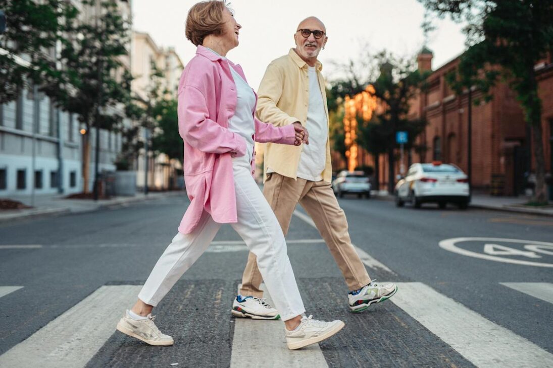 Elder couple walking for exercise in the city together 